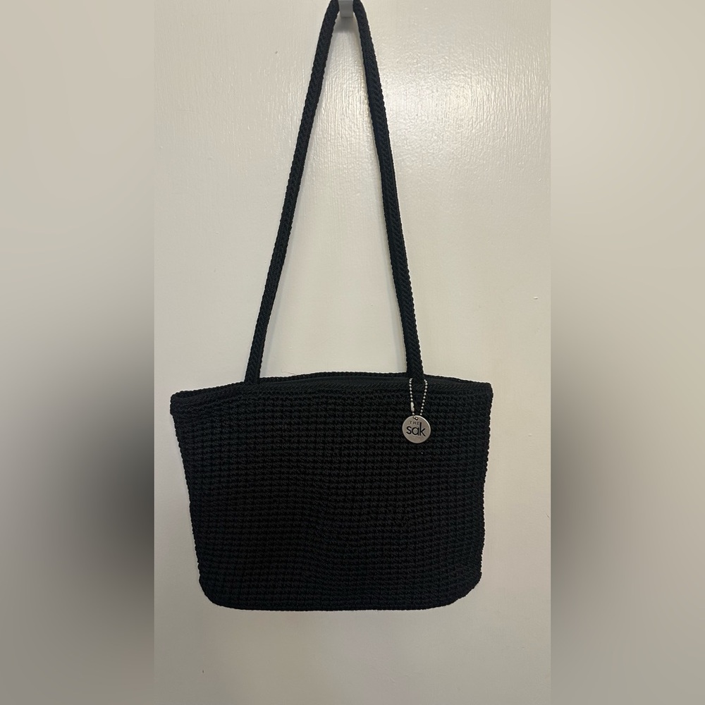The Sak Black Crochet Bag With Zip Closure with wallet.